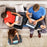 Duronic Laptop Tray with Cushion with Family using portable lap desks for laptops and tablets while relaxing on a living room sofa.