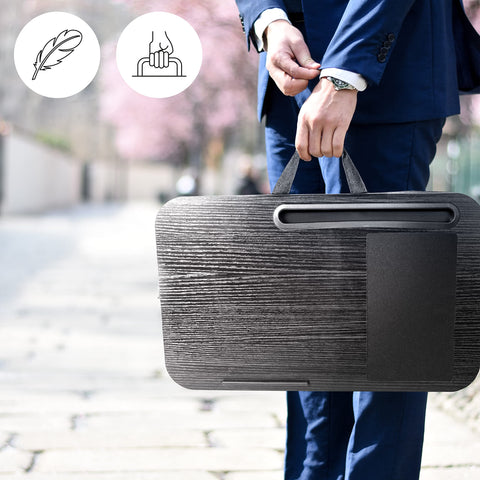 Duronic Laptop Tray with Cushion with handle, tablet slot, and mouse pad held by a businessman.