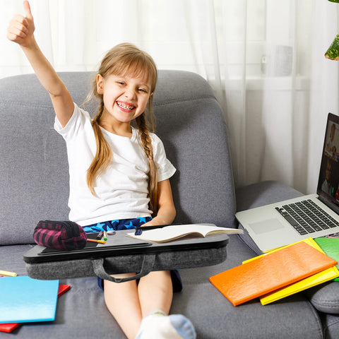 Duronic Laptop Tray with Cushion with stationery and laptop for remote learning.