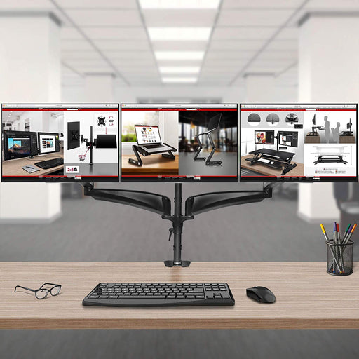 Duronic Monitor Arm Stand holding three side-by-side screens above a modern office workspace.