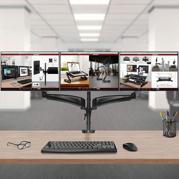 Duronic Monitor Arm Stand holding three side-by-side screens above a modern office workspace.
