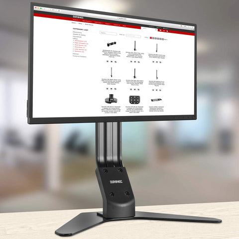 Duronic Monitor Arm Stand supporting a widescreen computer screen on a wooden table.