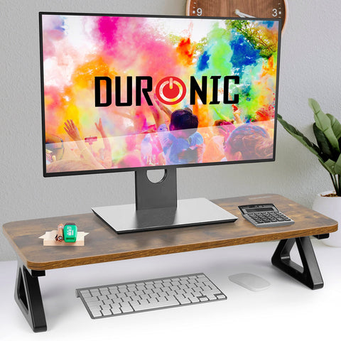Duronic Monitor Stand Riser with black triangular legs, supporting a monitor on a white desk.