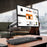 Duronic Monitor Stand Spare Arm holding a Dell screen over a wooden office desk.