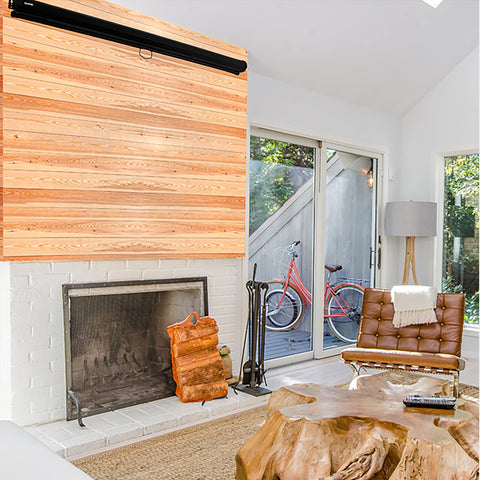 Duronic Projector Screen featuring a white brick fireplace, wood wall paneling, and unique wooden furniture."