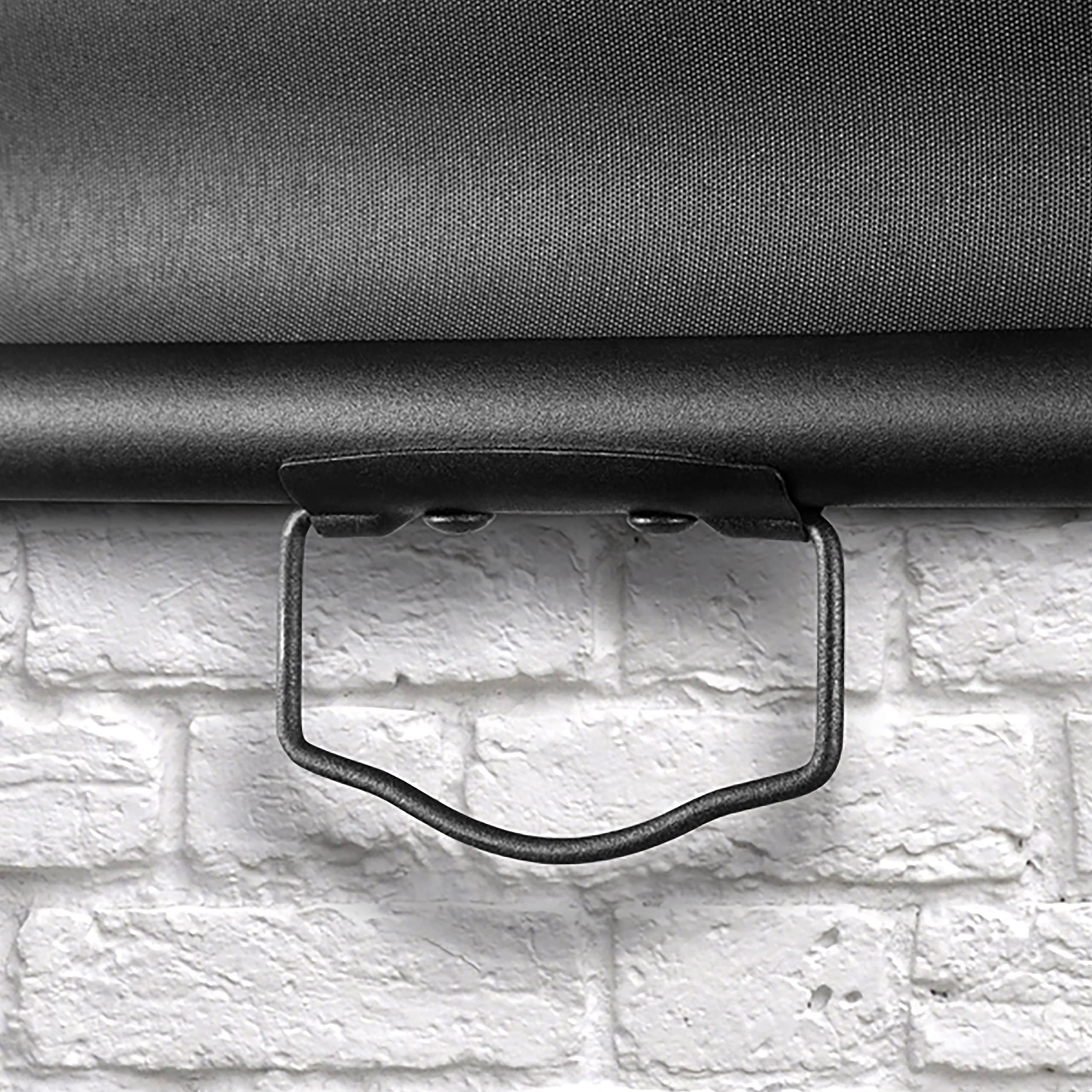 Duronic Projector Screen pull down projector screen handle against white brick wall.