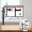 Duronic Single Monitor Arm Stand  with adjustable articulation arms clamped onto a wooden desk surface.