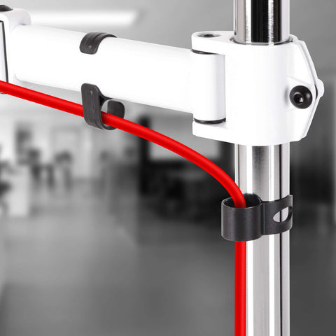 Duronic Single Monitor Arm with integrated cable management clips holding a bright red power cord.