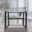 Duronic Sit-Stand Desk Frame featuring black metal legs on a wooden floor.