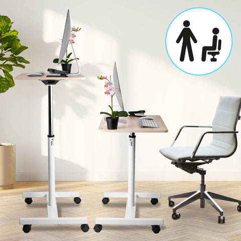 Duronic Sit-Stand Desk WPS67 shown in both its raised and lowered positions alongside an office chair, highlighting its versatility for sitting or standing work.