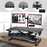 Duronic Sit-Stand Desk attached to a black standing desk converter via a grommet hole.