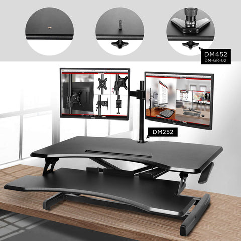 Duronic Sit-Stand Desk attached to a black standing desk converter via a grommet hole.