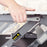 Duronic Sit-Stand Desk converter using the squeeze lever.