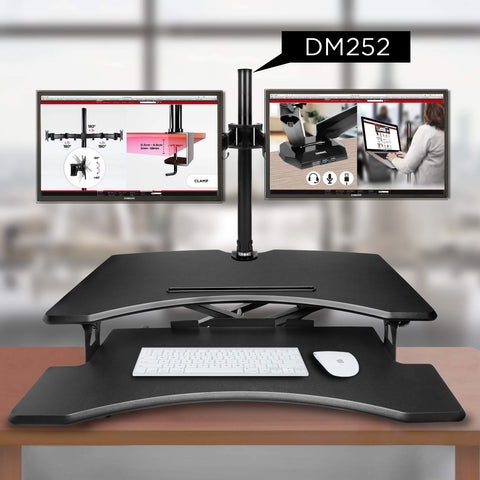 Duronic Sit-Stand Desk holding two screens above a black sit-stand desk converter.