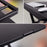 Duronic Sit-Stand Desk showing a black height-adjustable standing desk converter with a keyboard and mouse.