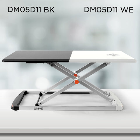 Duronic Sit-Stand Desk shown in both black and white color options with a silver X-frame lifting mechanism.
