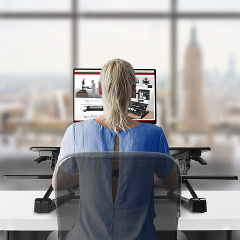 Duronic Sit-Stand Desk using an adjustable desktop standing desk converter.