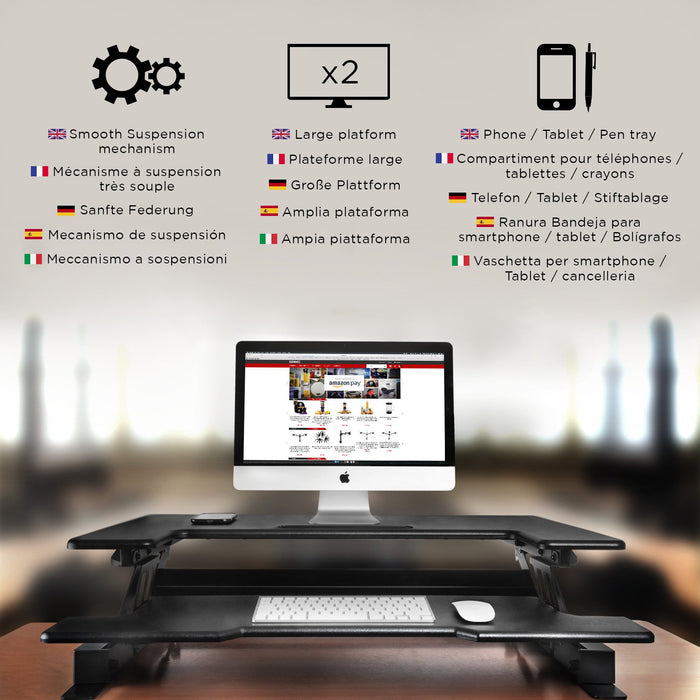 Duronic Sit-Stand Desk with a computer, dual monitor capacity, keyboard tray, and smartphone holder.