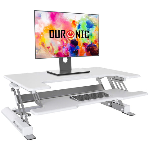 Duronic Sit-Stand Desk with a monitor and keyboard on a two-tier desktop.