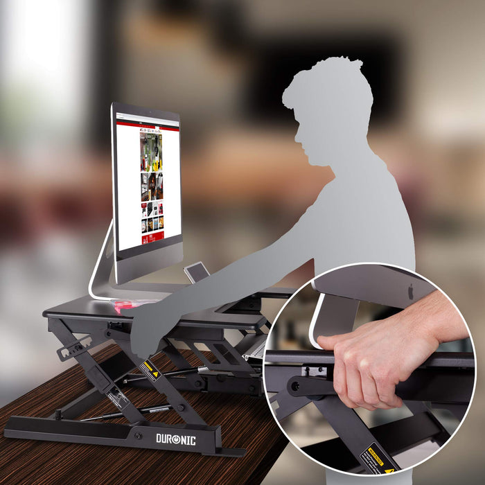 Duronic Sit-Stand Desk with a monitor on a wooden table.