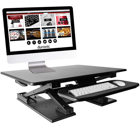 Duronic Sit-Stand Desk with dual tiers, featuring a computer monitor, keyboard, and mouse.