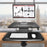 Duronic Sit-Stand Desk with keyboard tray clamped to wooden table holding a computer.