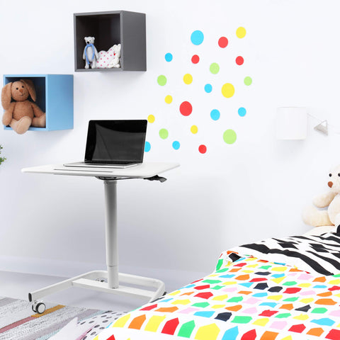Duronic Sit-Stand Desk with laptop in a modern colorful kids' bedroom or nursery.