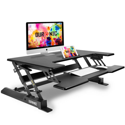 Duronic Sit-Stand Desk with two tiers holding a computer, keyboard, and tablet.
