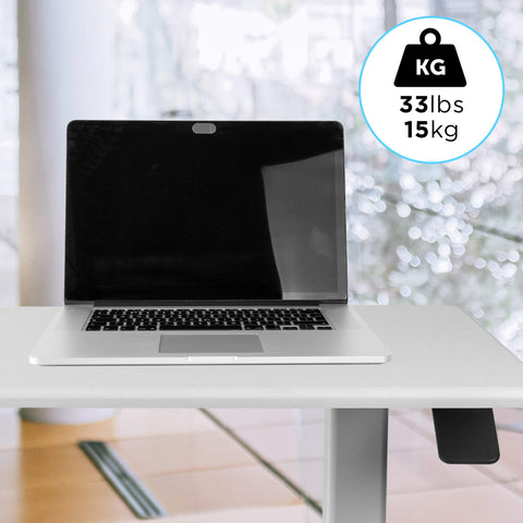 Duronic Sit Stand Desk Top with laptop showing a maximum weight capacity of 33lbs or 15kg.