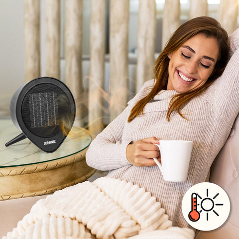 Duronic Small Ceramic Fan Heater  with a warm drink next to a Duronic heater.