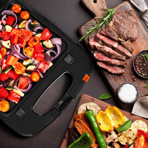 Duronic Spare Plates featuring colorful Mediterranean vegetables alongside a sliced medium-rare steak on a wooden board.