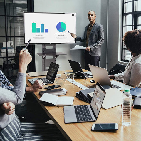 Duronic TV Mount Stand Bracket with A man presenting charts on a monitor to colleagues
