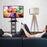 Duronic TV Stand Shelf with a Man lounging on a sofa 