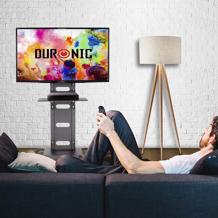 Duronic TV Stand Shelf with a Man lounging on a sofa 