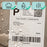 Duronic Thermal Labels with water droplets beading on its surface to demonstrate its water, oil, and scratch-resistant properties.