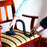 Duronic VC7 Vacuum Cleaner Accessories with brush attachment cleaning a striped upholstered vintage wooden dining chair.