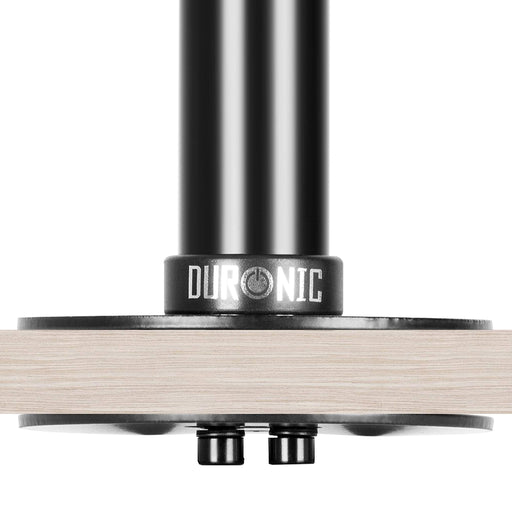 Duronic Wall Mount with black metal grommet mount secured to a light wood desk.