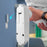 Duronic Wall Mounted Fan with hand holding to align with a silver metal mounting bracket.