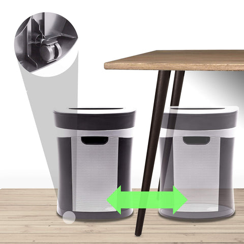 Duronic XXL Cross Cut Paper Shredder with wheels shown sliding easily underneath an office desk.
